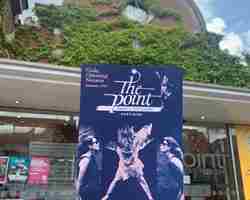 Point opening season programme held up in front of the venue